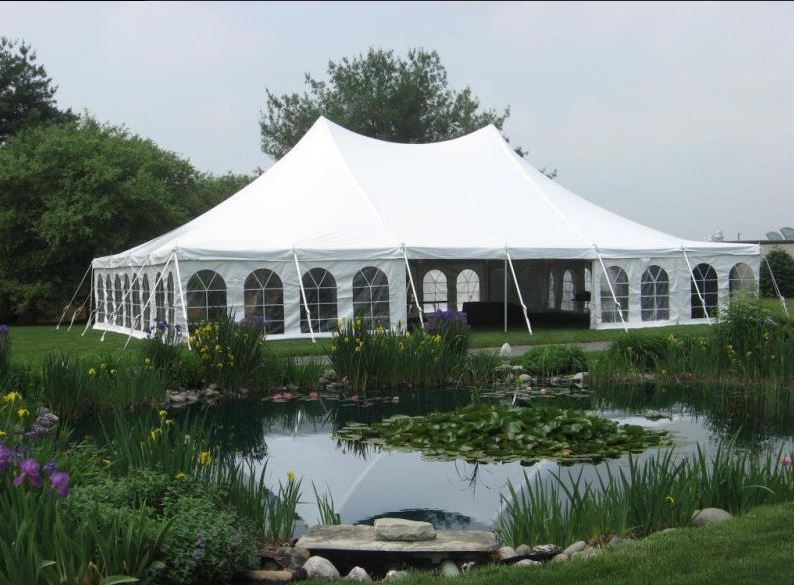 Pole tent rental installation by Ralston Suppy Center of Syracuse, NY