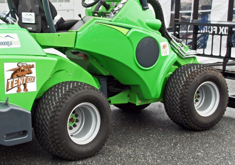 Driving a Tent OX machine, here pictured with available turf tires, makes for a comfortable, low-impact ride that won’t damage finely manicured lawns or playing fields.